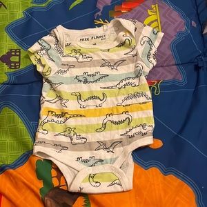 Dino onesie with colored stripes washed before sent